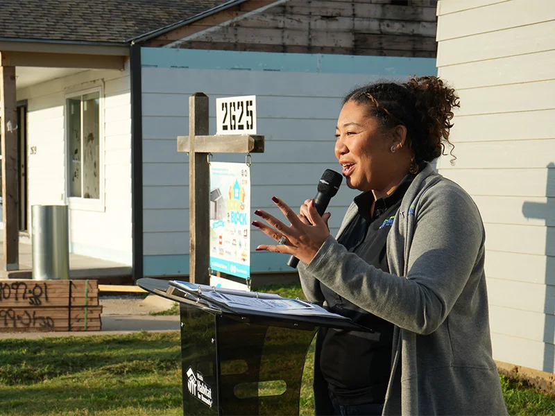 Danielle holding a microphone.