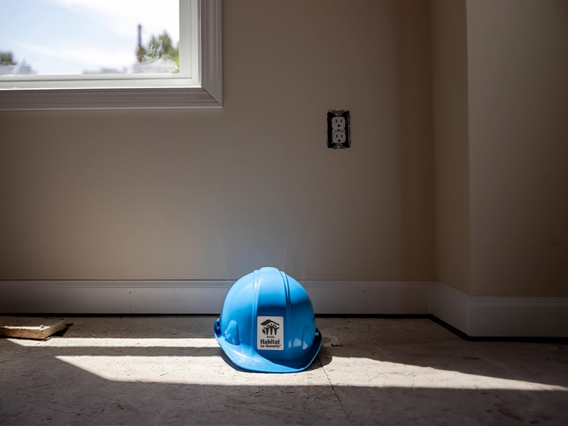 A hard hat sitting on the ground.