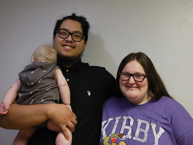 Family partners Luis and Jordan smiling together.