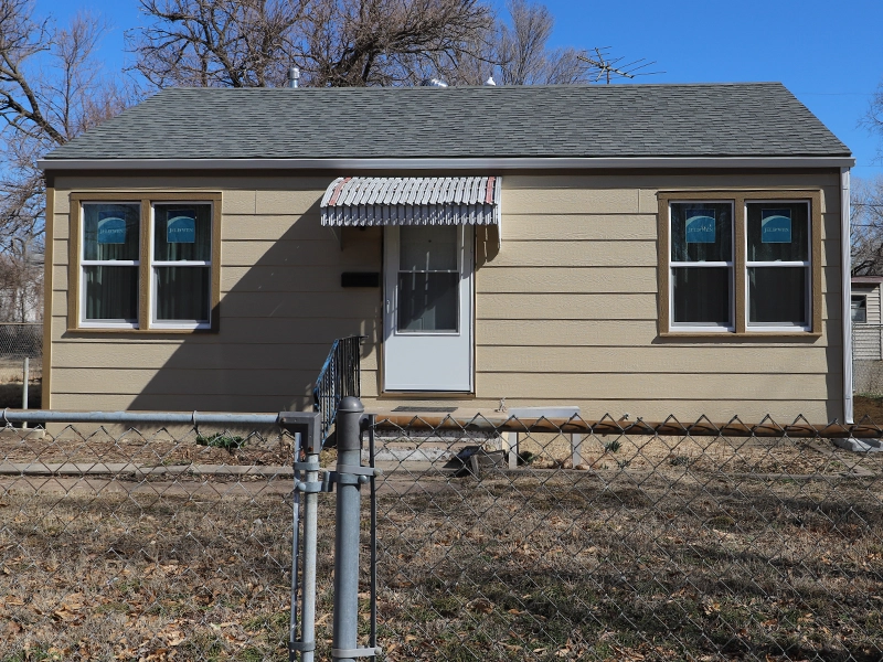 A house with its brand-new and completed siding.