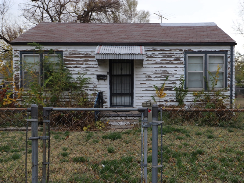 A house having its siding replaced.
