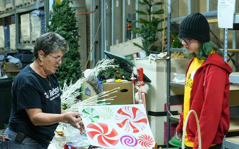 ReStore volunteers helping in the backroom.